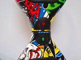 a close up of a skateboard that has been painted with graffiti