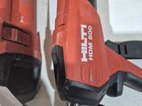 two electric tools that are sitting on a table