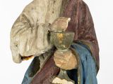 statue of a man holding a wine glass in his hand