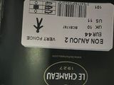 a black box with a sticker on it sitting on the grass