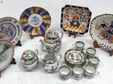 many plates and cups and saucers on a table