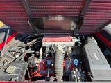 a red truck with a red engine in it