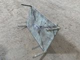 a metal object that is laying on the ground