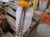 a picture of a chainsaw sitting on a pallet