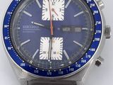 an image of a watch with a blue face and a silver bracelet
