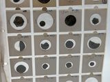 a person holding a piece of paper with a bunch of eyes on it