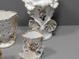 a group of vases that are sitting on a table