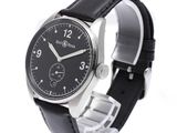the watch is black and silver with a black leather band