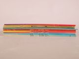 several children ' s books stacked on top of each other on a table