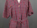 a red and blue plaid dress on a mannequin mannequin mannequin mannequin mannequin mannequin mannequin mannequin