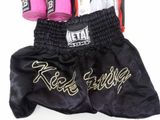 black and pink boxing shorts with gold lettering and pink boxing gloves