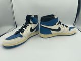 a pair of blue and white sneakers on a white surface