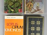 three books are sitting on a table next to each other