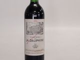 a bottle of wine that is sitting on a table