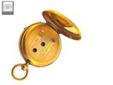 a gold pocket watch with a keychain on a white background