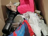 a cardboard box filled with toys and other items