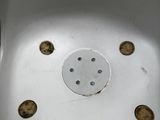 a white sink with holes in the bottom of it