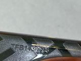 a close up of a person ' s hand holding a pair of scissors