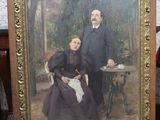 tableau représentant un homme et une femme assis devant une table