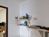 a computer desk with a keyboard and a monitor on it