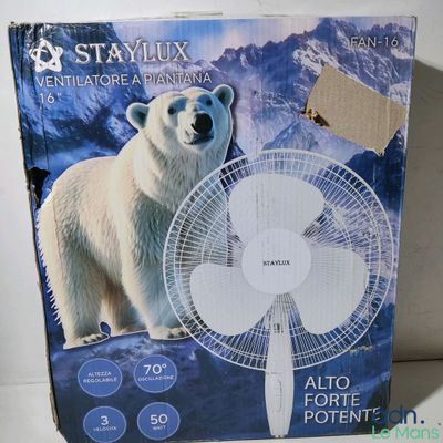 the box of a white polar bear fan sitting on top of a table