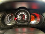 a close up of a car dashboard with a speedometer and gauges