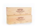 two wooden boxes of wine are stacked on top of each other