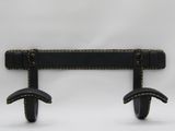 pair of black leather wall hooks on a white background