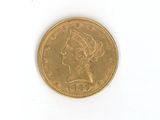 une pièce d'or ornée d'une tête de femme