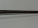a very long dagger that is on the table