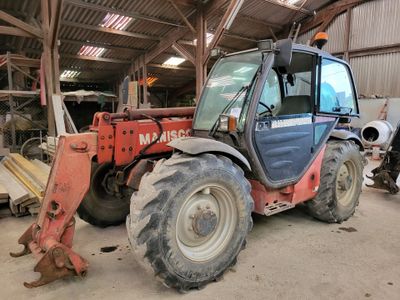 a tractor that is parked inside of a building