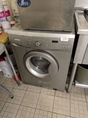 a washer and a dryer in a small room