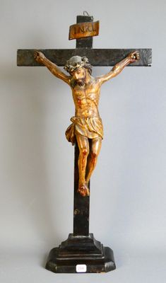 a statue of jesus on a cross on a table