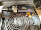 a drill and a cord in a case