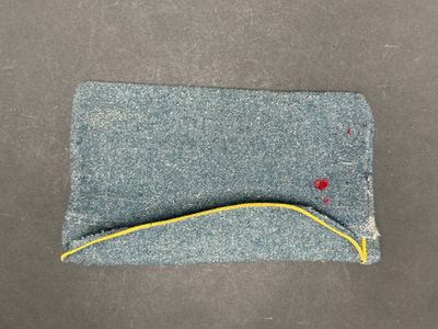a close up of a piece of cloth with a yellow line