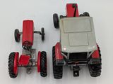 a toy tractor and a toy car on a white surface