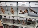 many boxes of lingersuits on display in a store