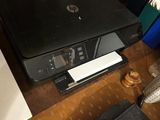 a printer and a calculator sitting on a desk