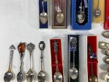 a lot of silver spoons and spoon spoons on the table