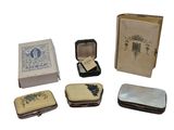 a small box with a book, a book case, a book, and other items in it