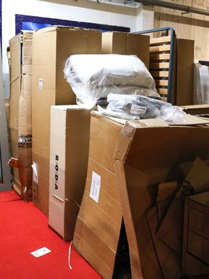 many boxes stacked on top of each other in a room