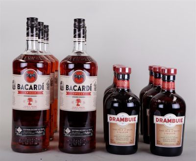 four bottles of alcohol are lined up on a table