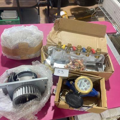 a box of assorted items on a pink table