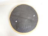 a black and yellow cake with white dots on it