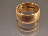 a gold ring sitting on top of a table