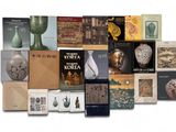 a lot of books that are sitting on a table