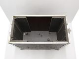 a metal box that is open on a white surface