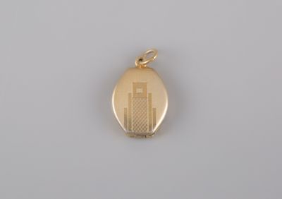 a gold locke with a picture of a building on it