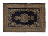 a black and gold rug with a medallion design on it