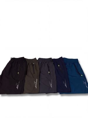a set of five men ' s sweatpantss in various colors